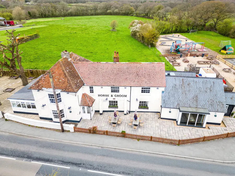 a drone image of the front of the horse and groom pub ningwood iw