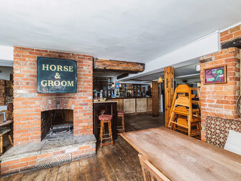 the large brick fireplace in the main bar